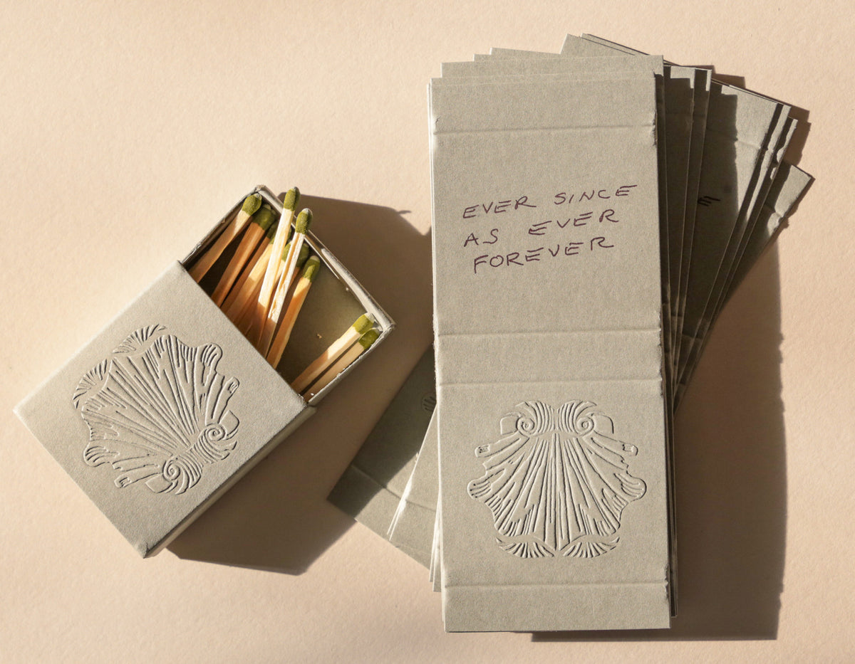 Matches with a decorative box on a beige background