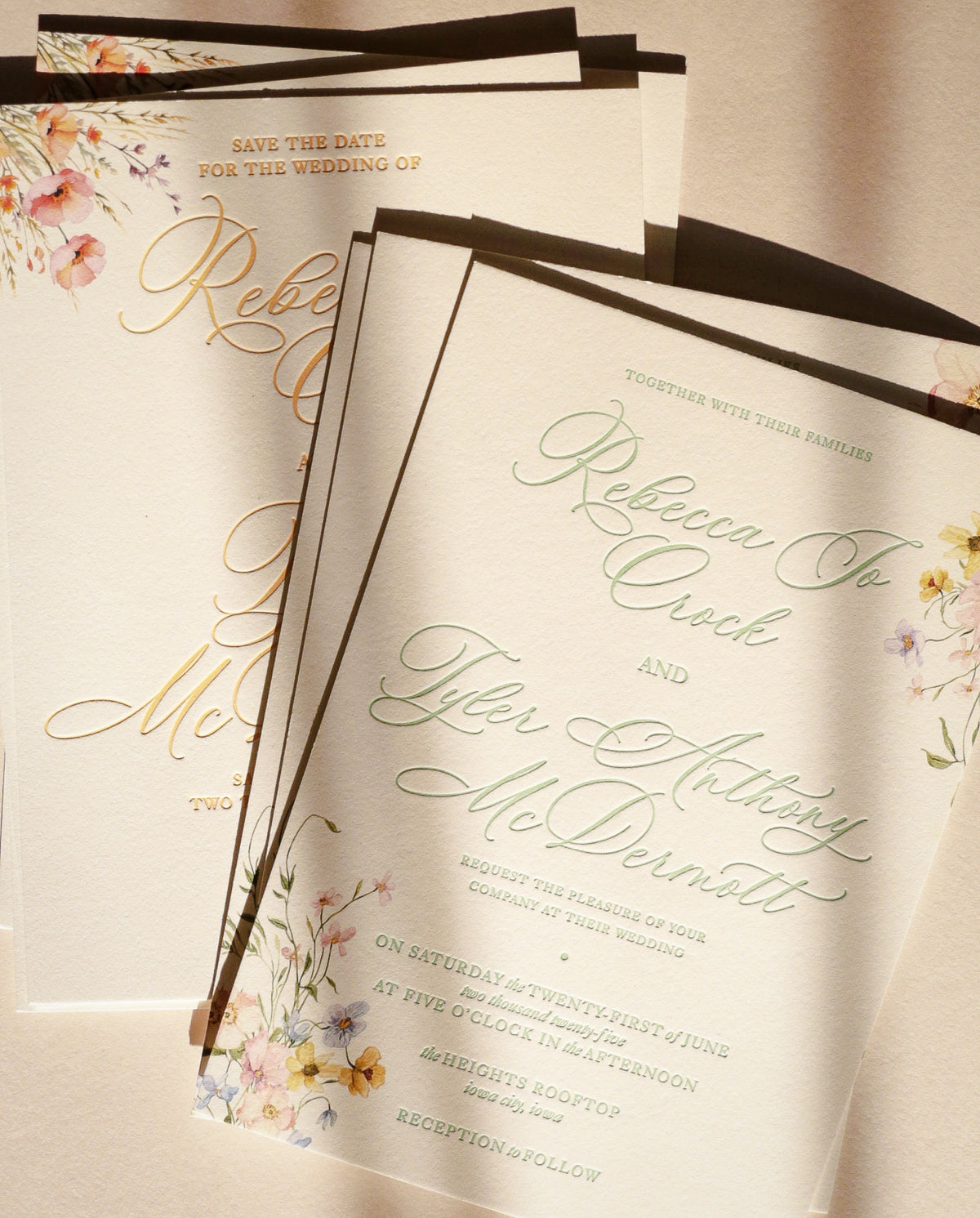 Wedding invitation with floral designs and text on a beige background