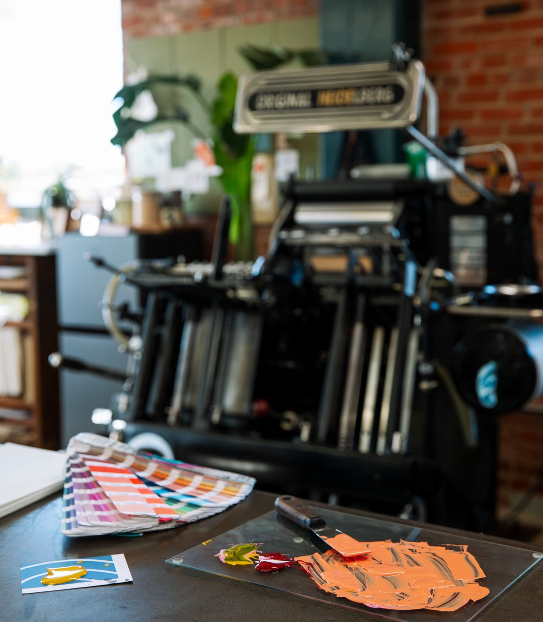 Letterpress printing equipment with color swatches and mixed ink.
photo by Alyssa Broadus